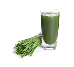Photo of Wheat grass drink in shot glass and fresh green sprouts isolated on white