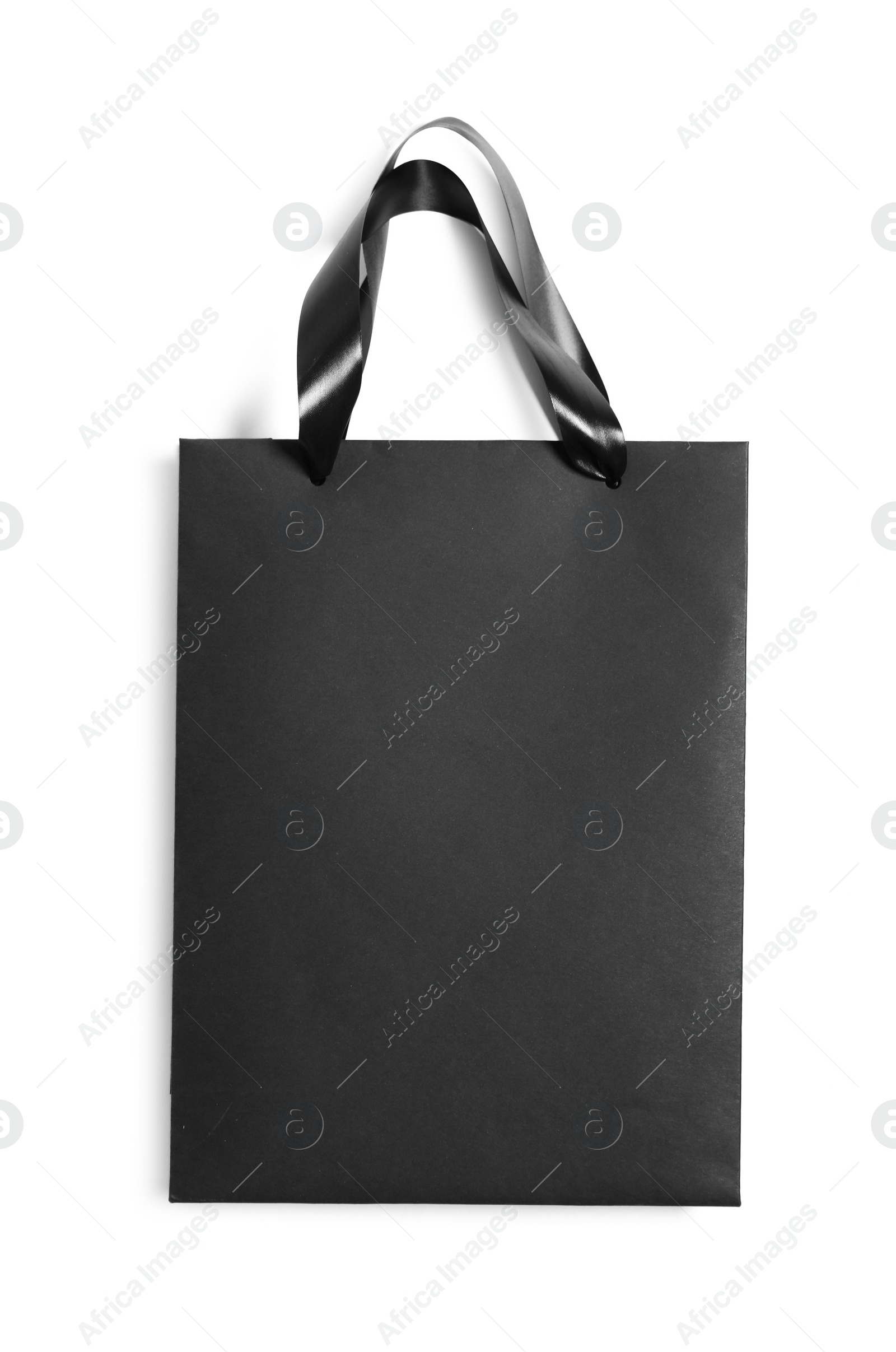 Photo of One black paper shopping bag isolated on white, top view