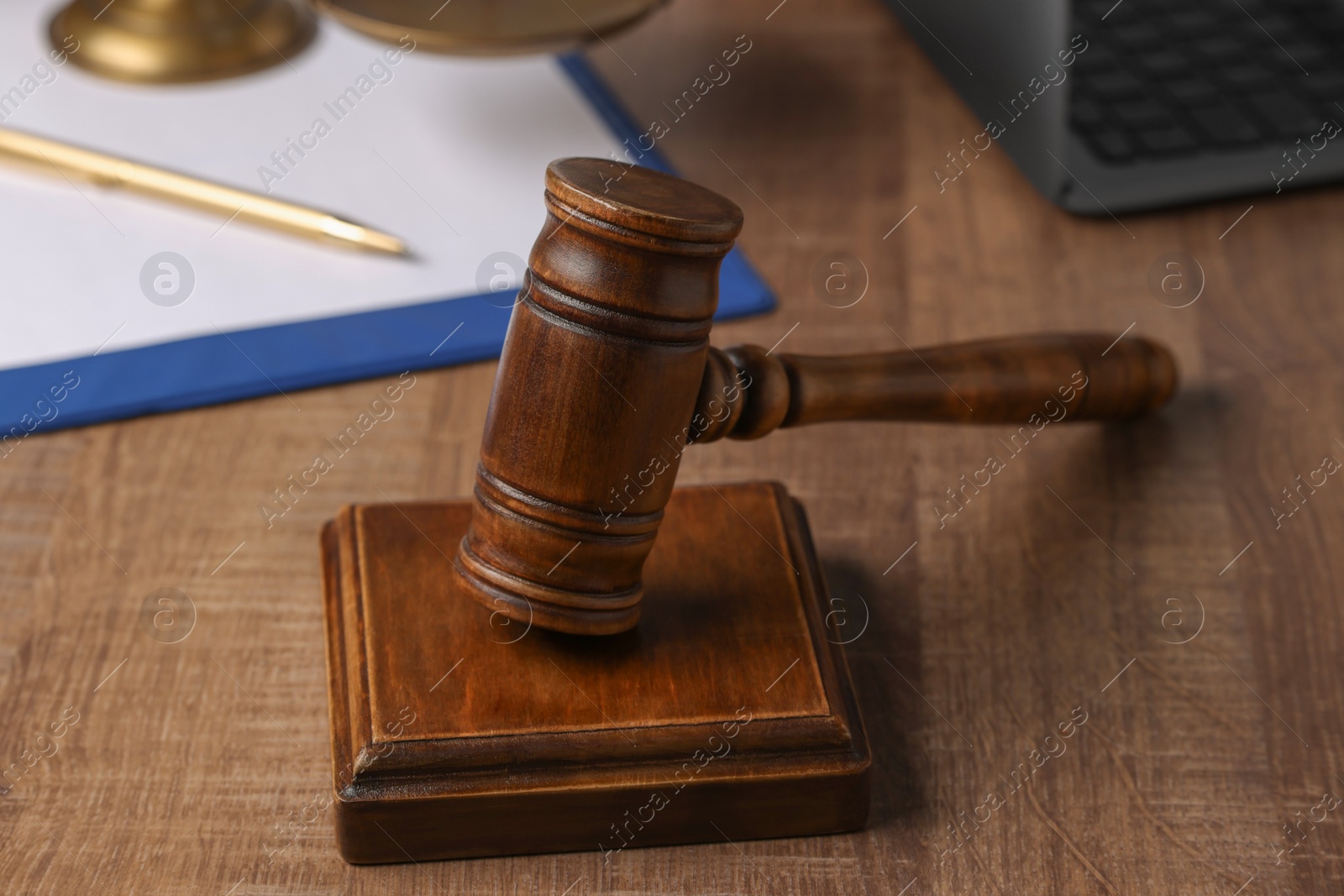 Photo of Law concept. Mallet on wooden table, closeup