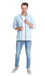 Photo of Young man in stylish jeans on white background