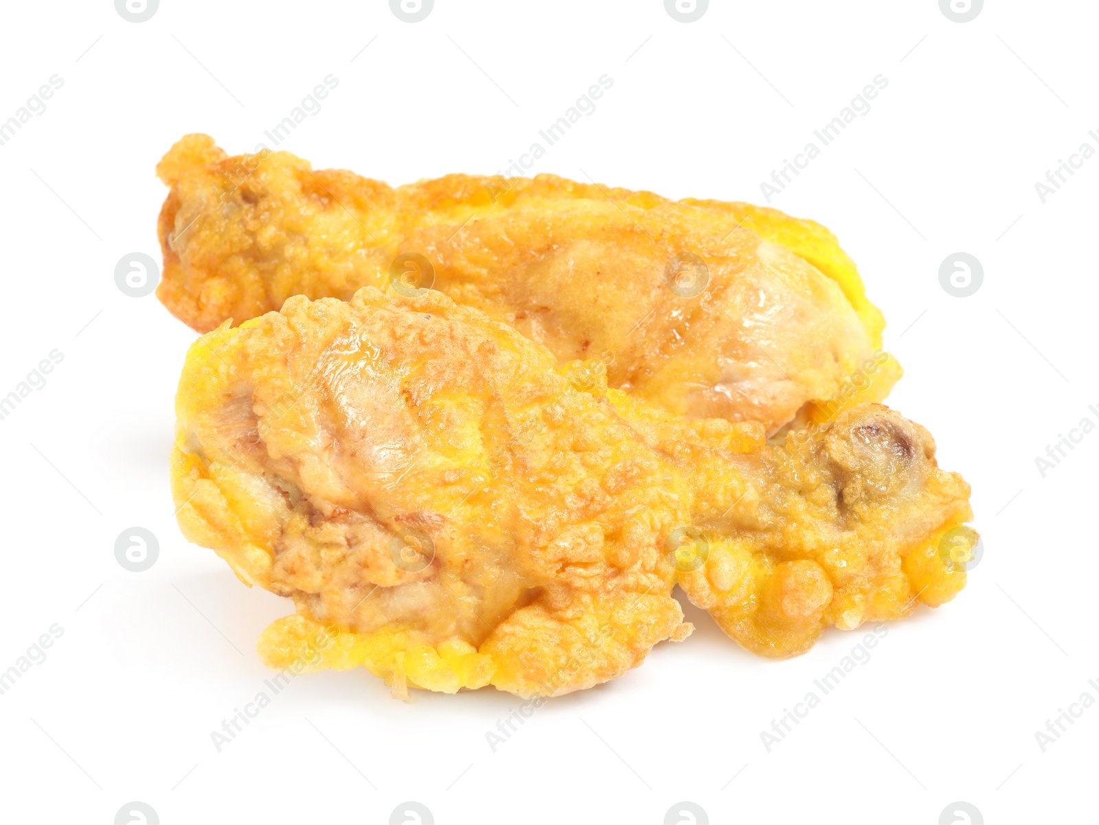 Photo of Tasty deep fried chicken drumsticks isolated on white