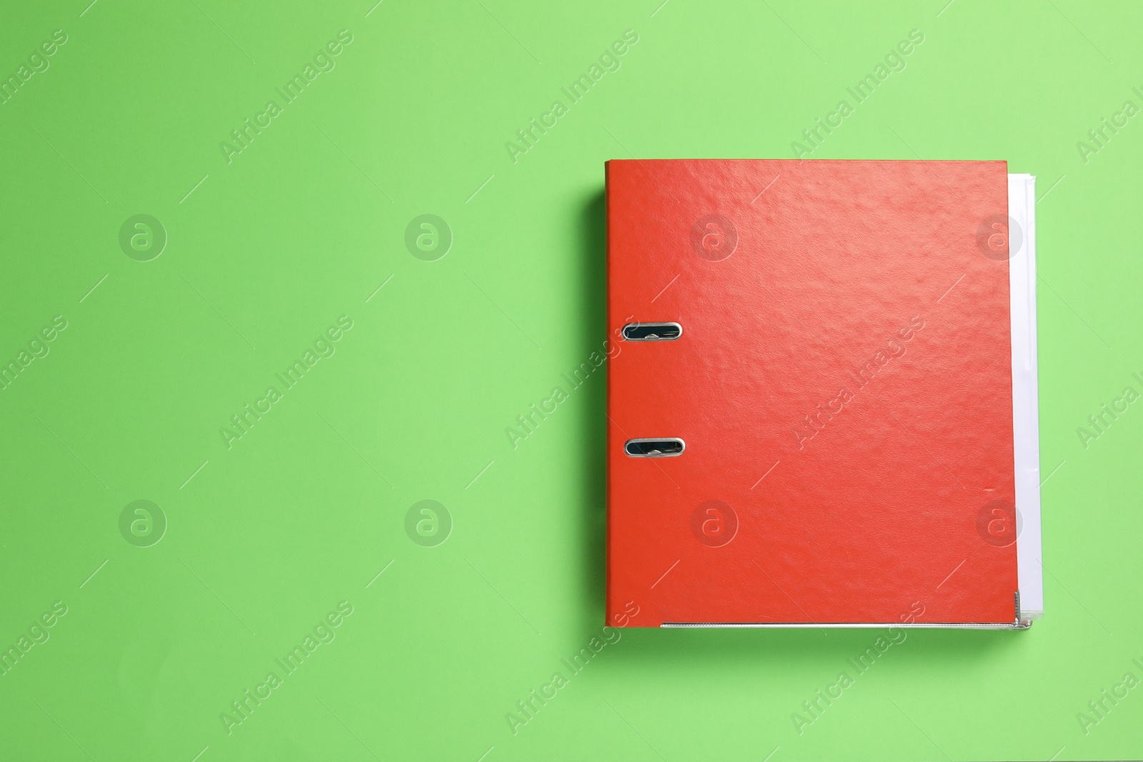 Photo of Red office folder on light green background, top view