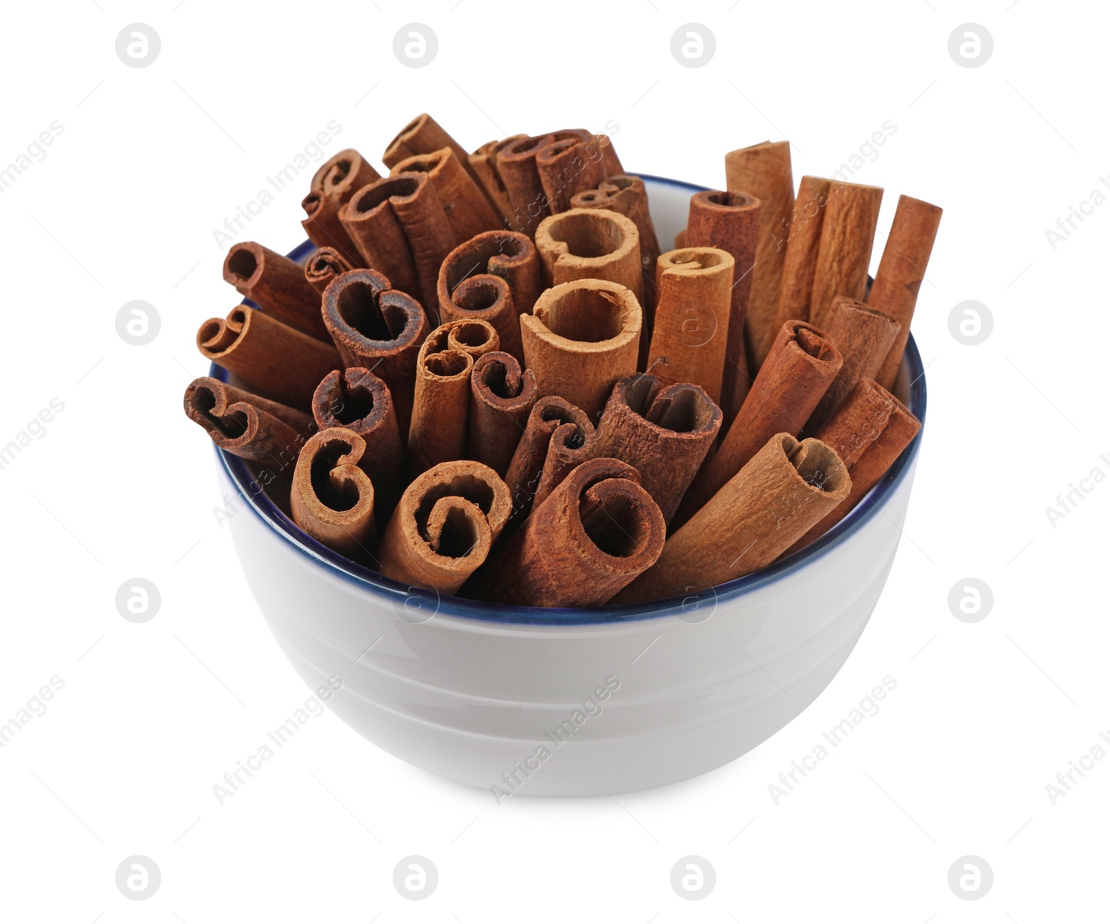 Photo of Cinnamon sticks in bowl isolated on white