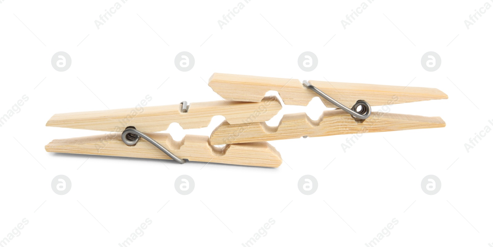 Photo of Two classic wooden clothespins on white background