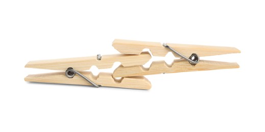 Two classic wooden clothespins on white background