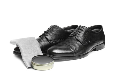 Stylish men's footwear and shoe care accessories on white background