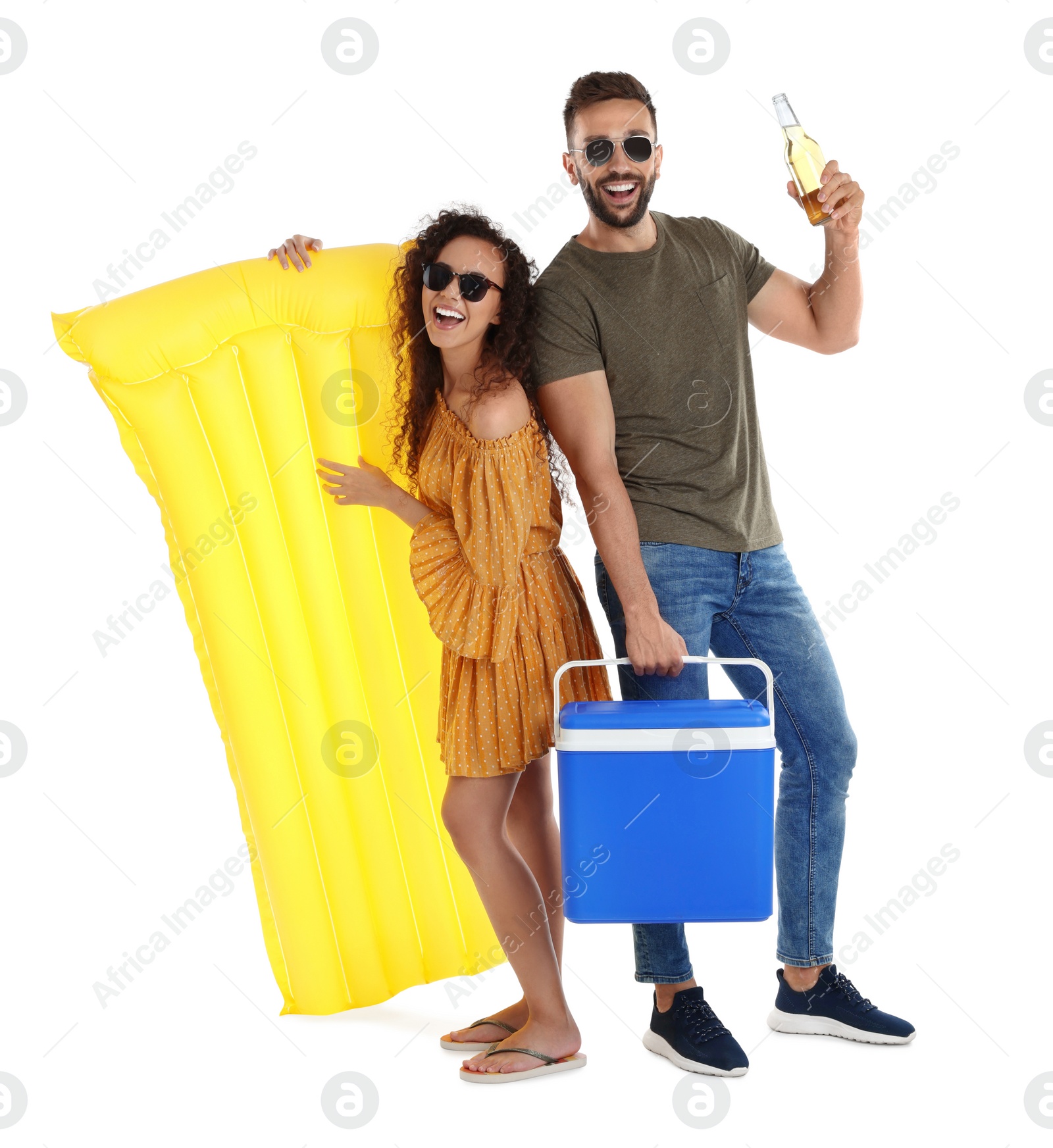 Photo of Happy couple with cool box, inflatable mattress and bottle of beer on white background