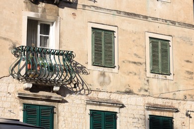 Exterior of old residential building with balcony