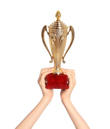 Young woman holding gold trophy cup on white background, closeup