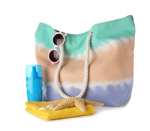 Composition with bag and beach accessories on white background