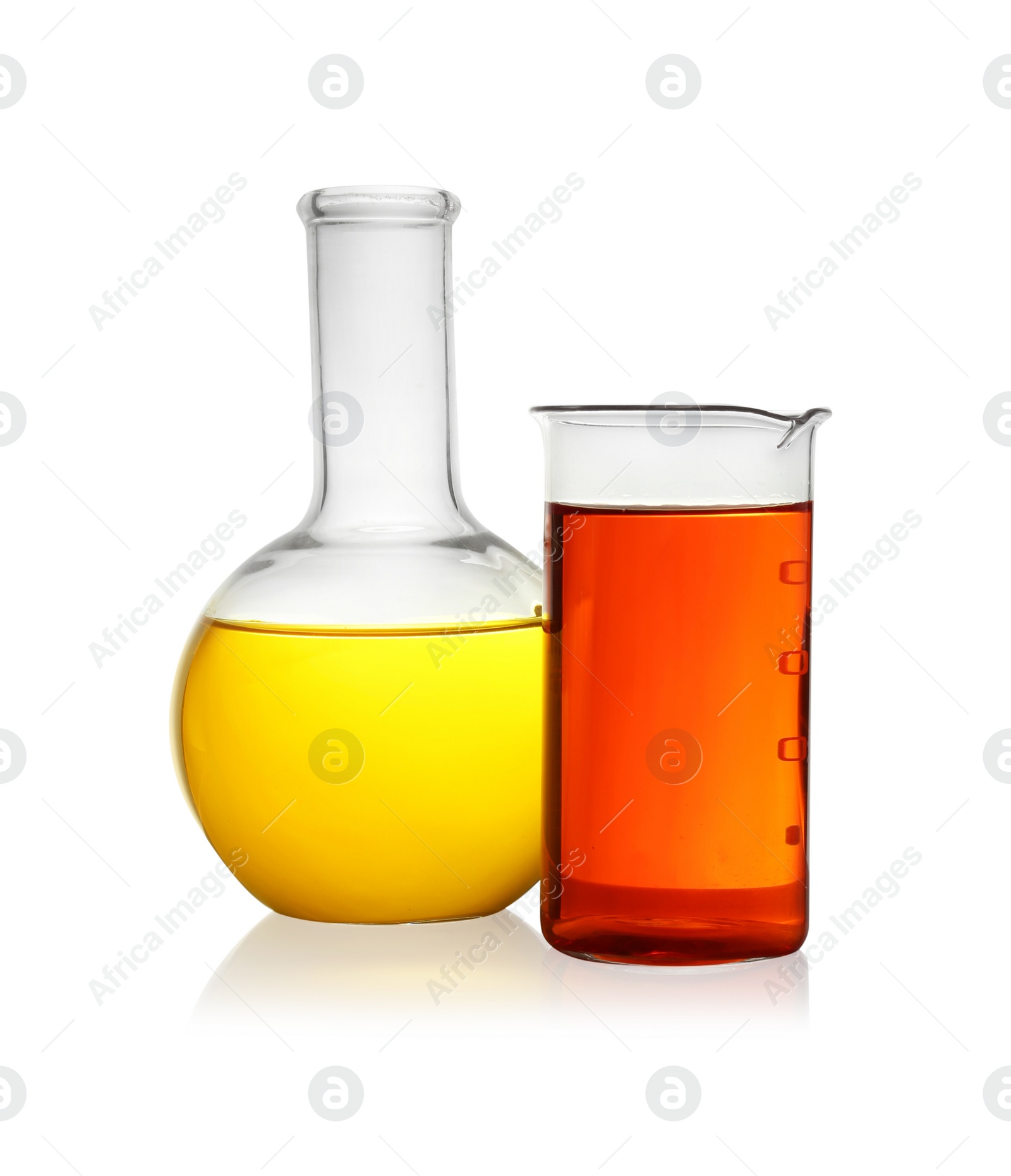 Photo of Laboratory glassware with colorful liquids on white background