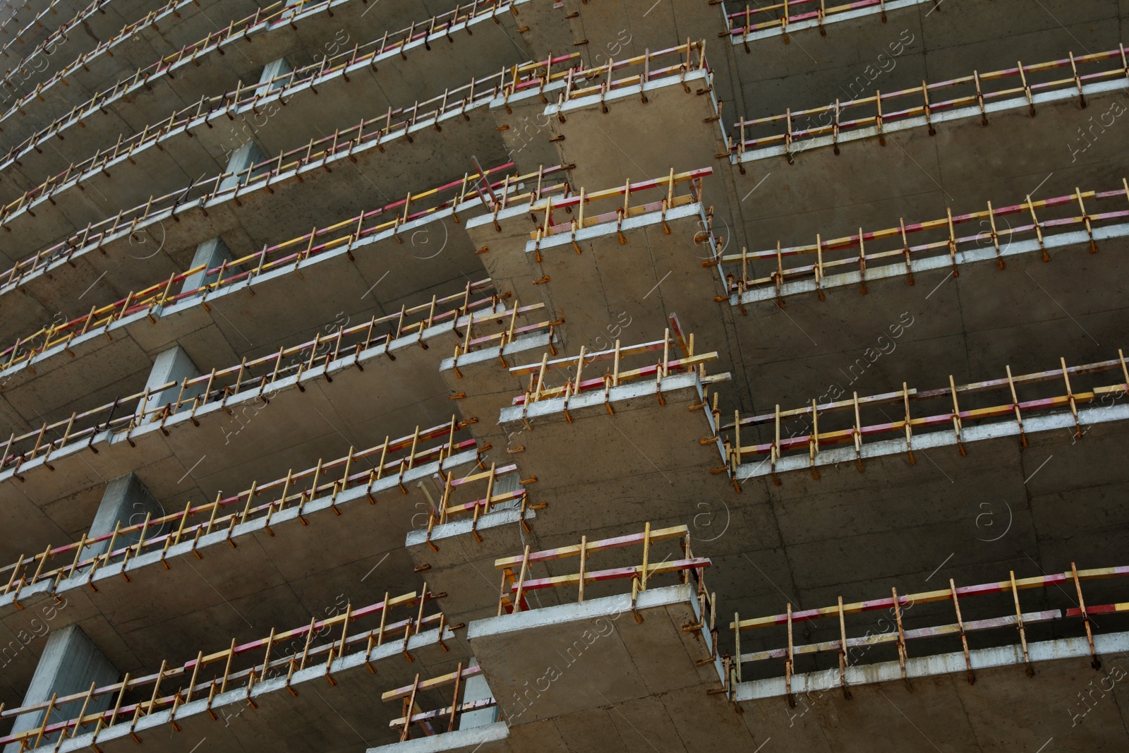 Photo of Construction site with unfinished building, low angle view