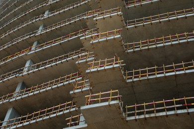 Construction site with unfinished building, low angle view