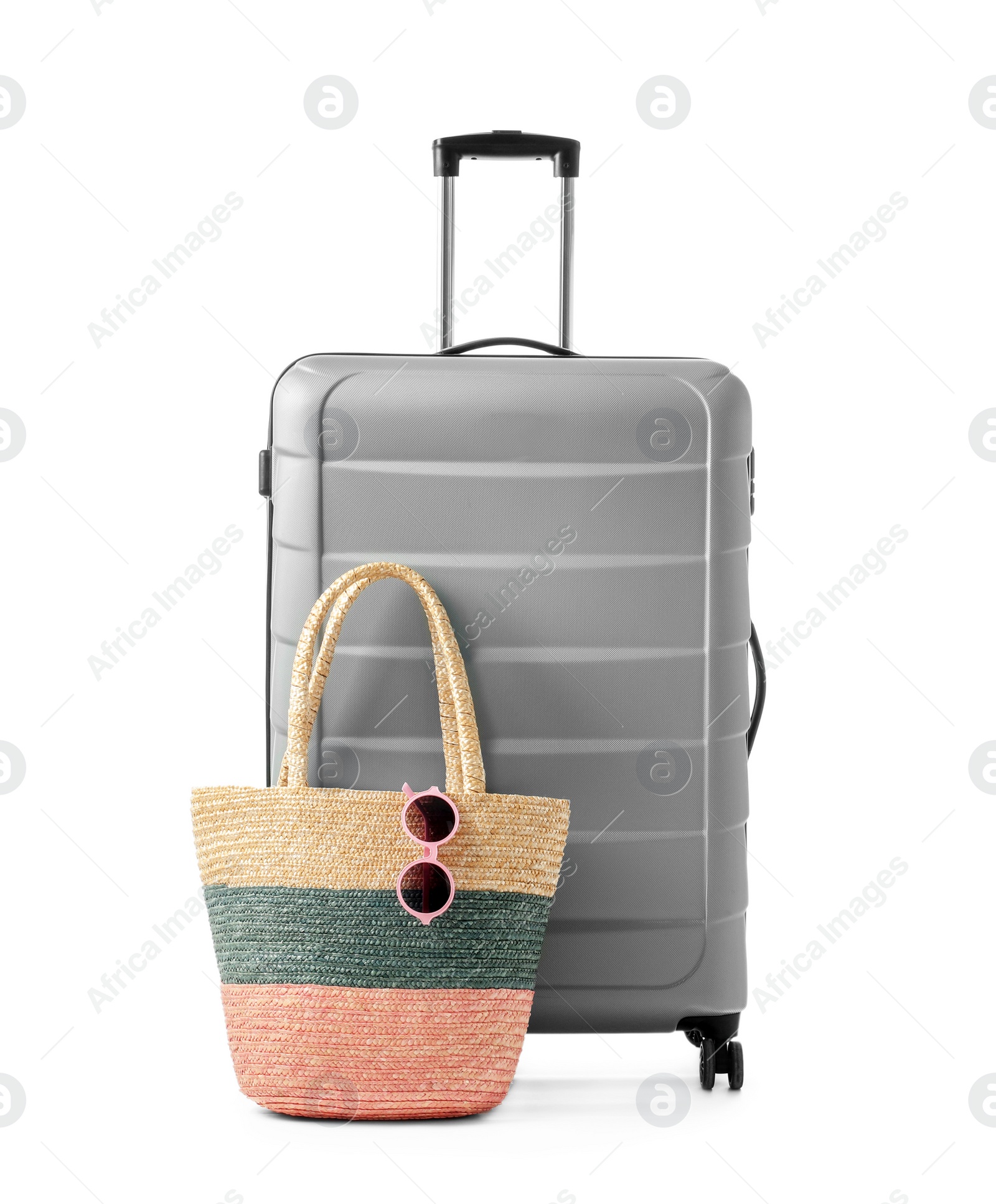 Photo of Gray suitcase and bag packed for journey on white background