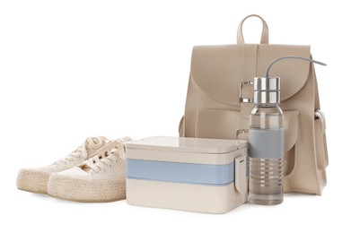 Photo of Stylish shoes, backpack, lunch box and bottle of water on white background