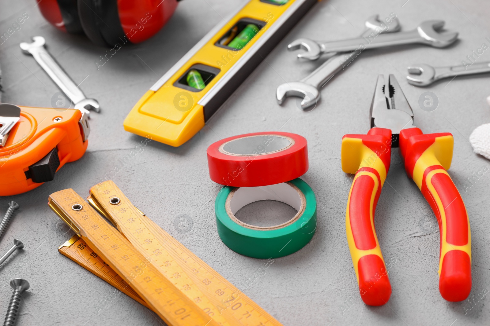 Photo of Different construction tools on light grey background