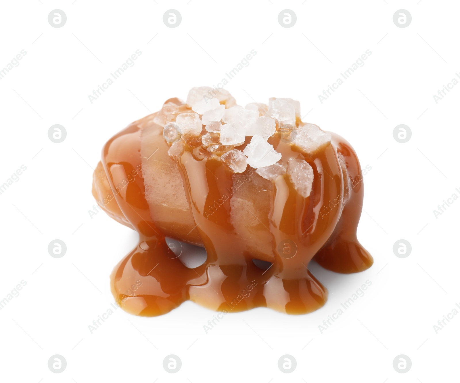 Photo of Yummy candy with caramel sauce and sea salt isolated on white