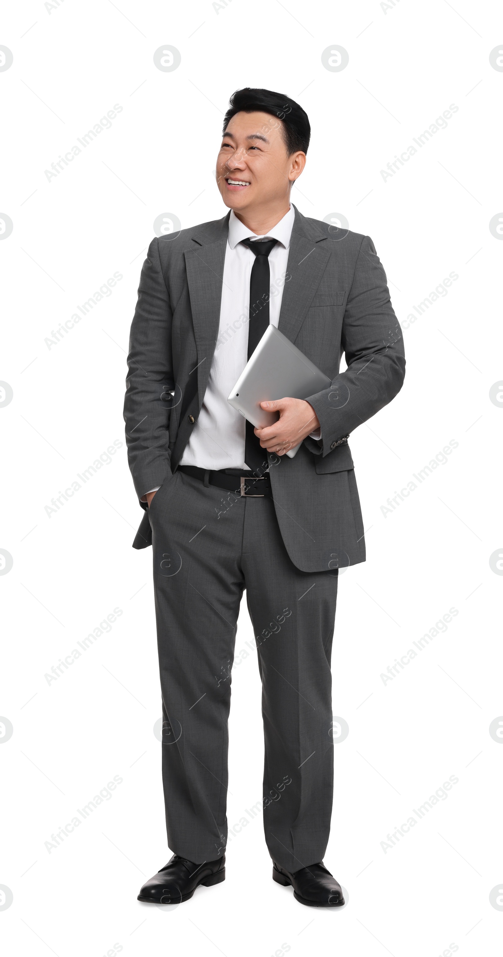 Photo of Businessman in suit with tablet on white background