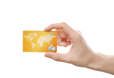 Photo of Young man holding credit card on white background