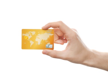 Young man holding credit card on white background