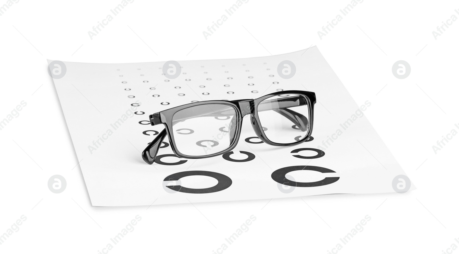 Photo of Glasses and vision test chart isolated on white