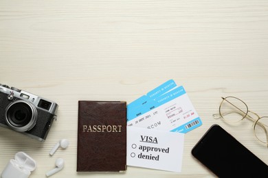 Photo of Flat lay composition with passport and tickets on white wooden background, space for text. Visa receiving