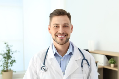 Photo of Male medical assistant in clinic. Health care service