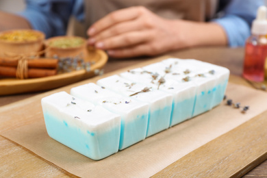 Natural handmade soap on wooden table, closeup