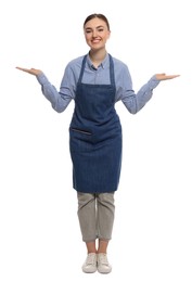 Beautiful young woman in clean denim apron on white background