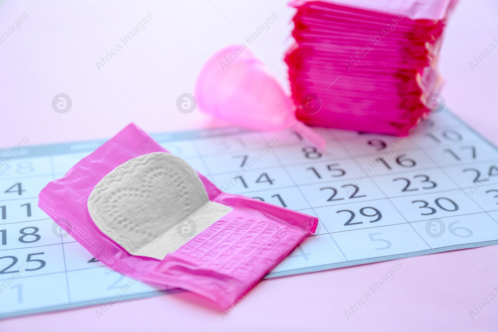 Photo of Menstrual pad and calendar on table. Gynecological care