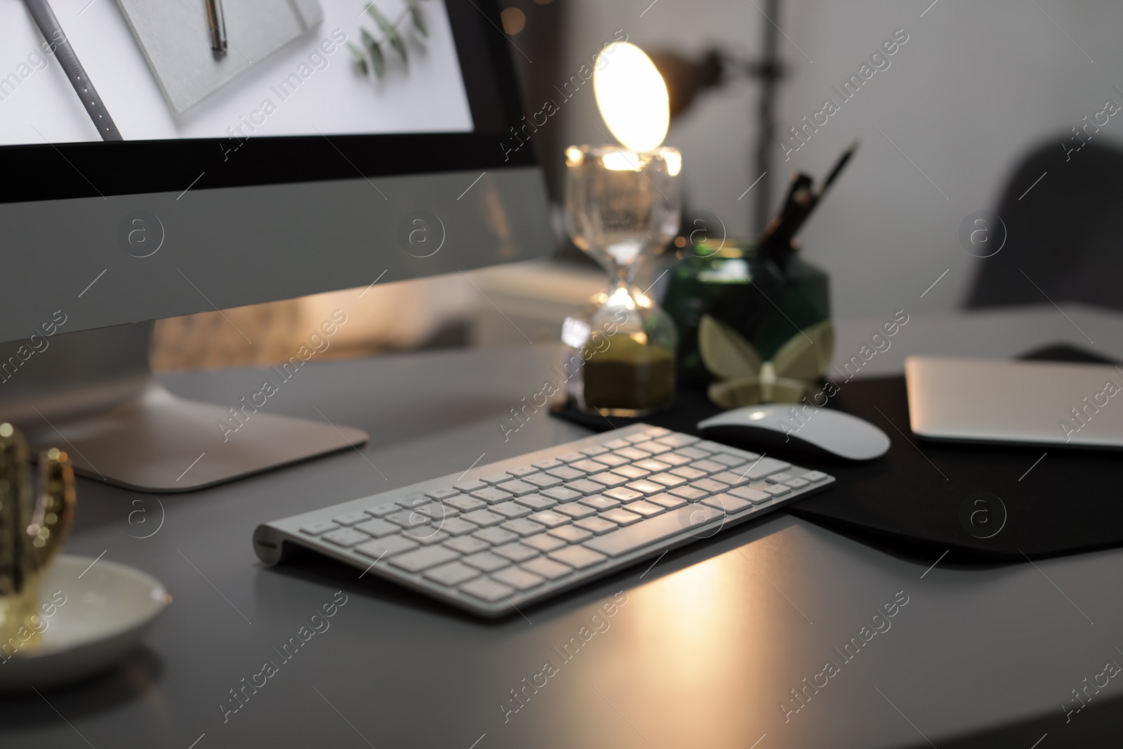 Photo of Stylish workplace with modern computer on desk, space for text. Focus on keyboard