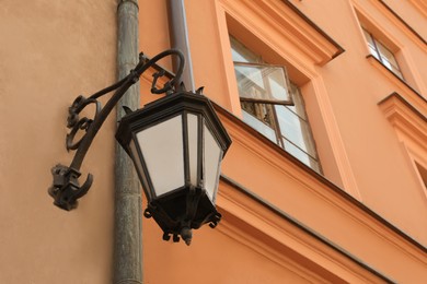 Vintage street lamp on wall of building