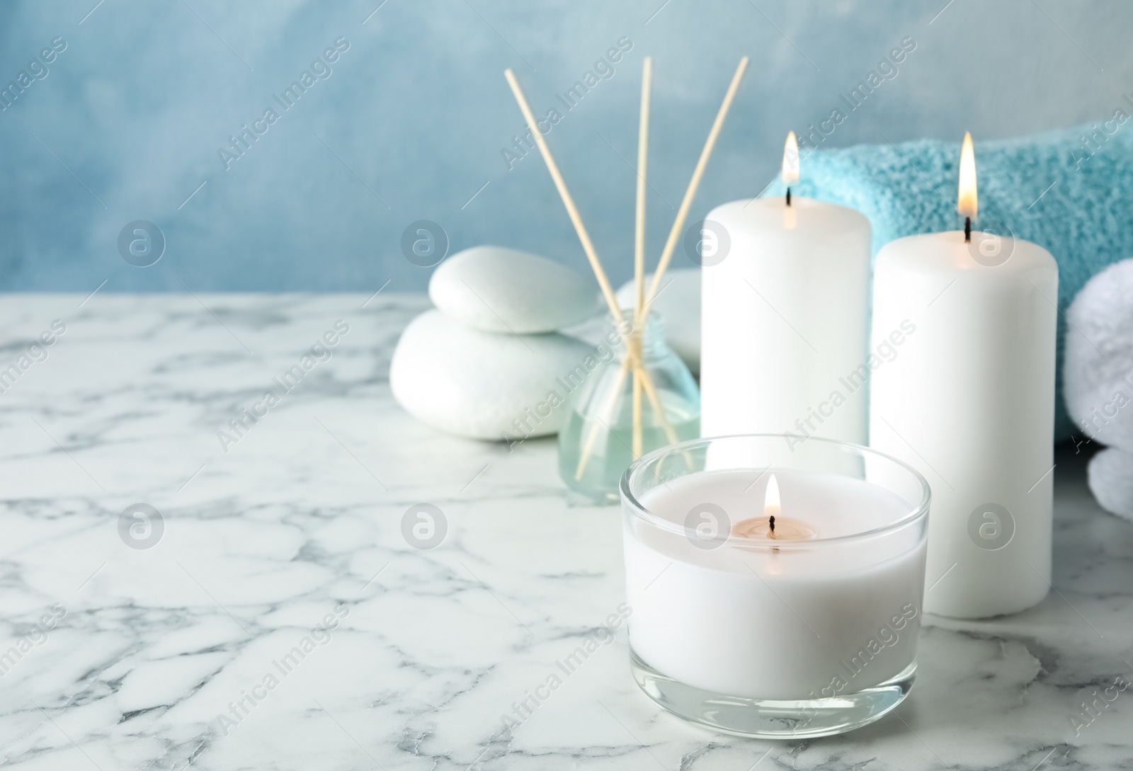 Photo of Beautiful spa composition with candles on table, space for text