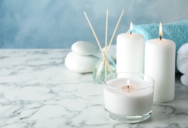 Beautiful spa composition with candles on table, space for text