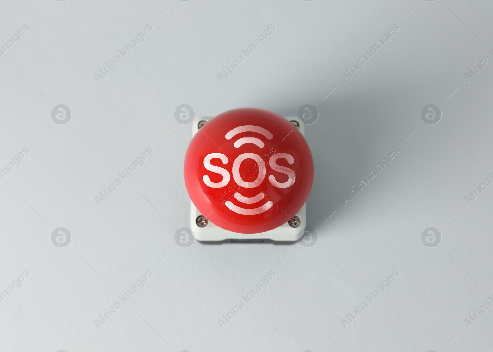 Image of Red SOS button on white background. Space for text