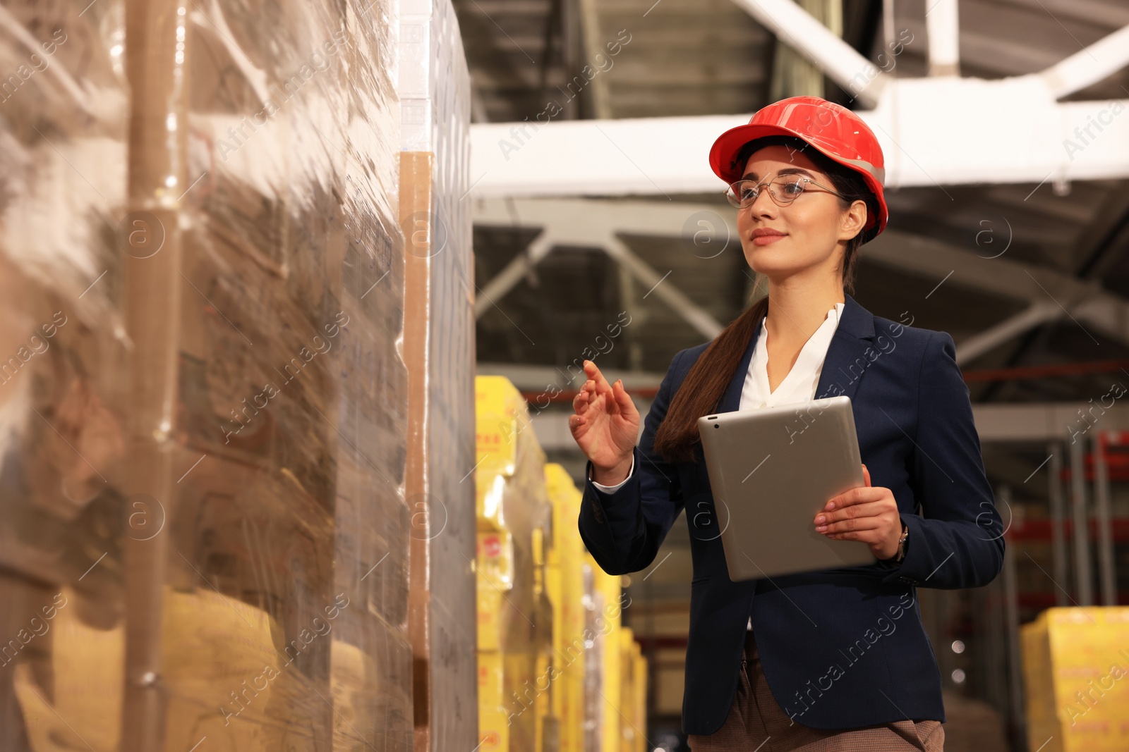 Image of Manager with tablet working at warehouse. Logistics center