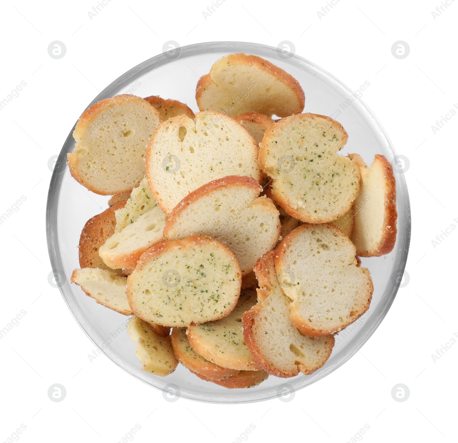 Photo of Crispy rusks with seasoning in bowl isolated on white, top view