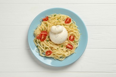 Plate of delicious pasta with burrata and tomatoes on white wooden table, top view