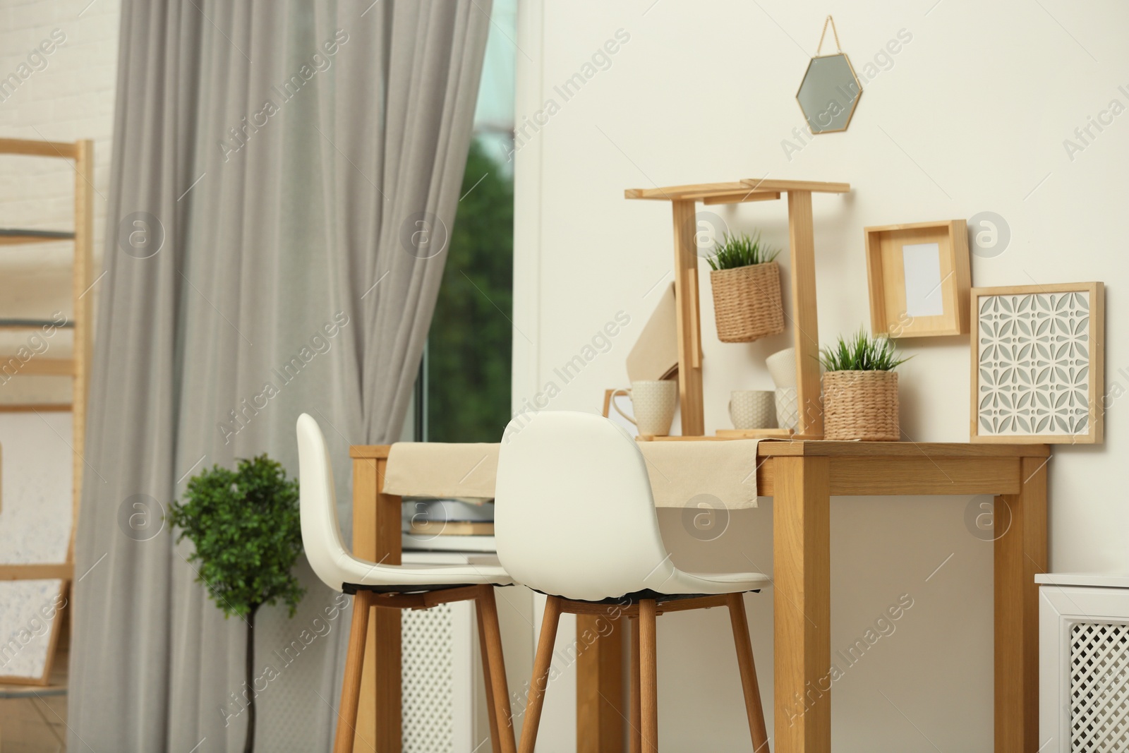 Photo of Modern room interior with wooden dining table