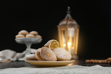 Plate of traditional cookies for Islamic holidays on table. Eid Mubarak