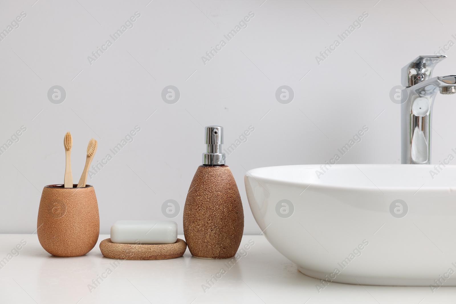 Photo of Set of different bath accessories and products on white table