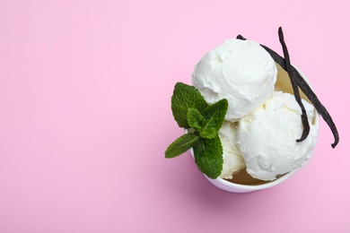 Delicious vanilla ice cream on pink background, top view. Space for text