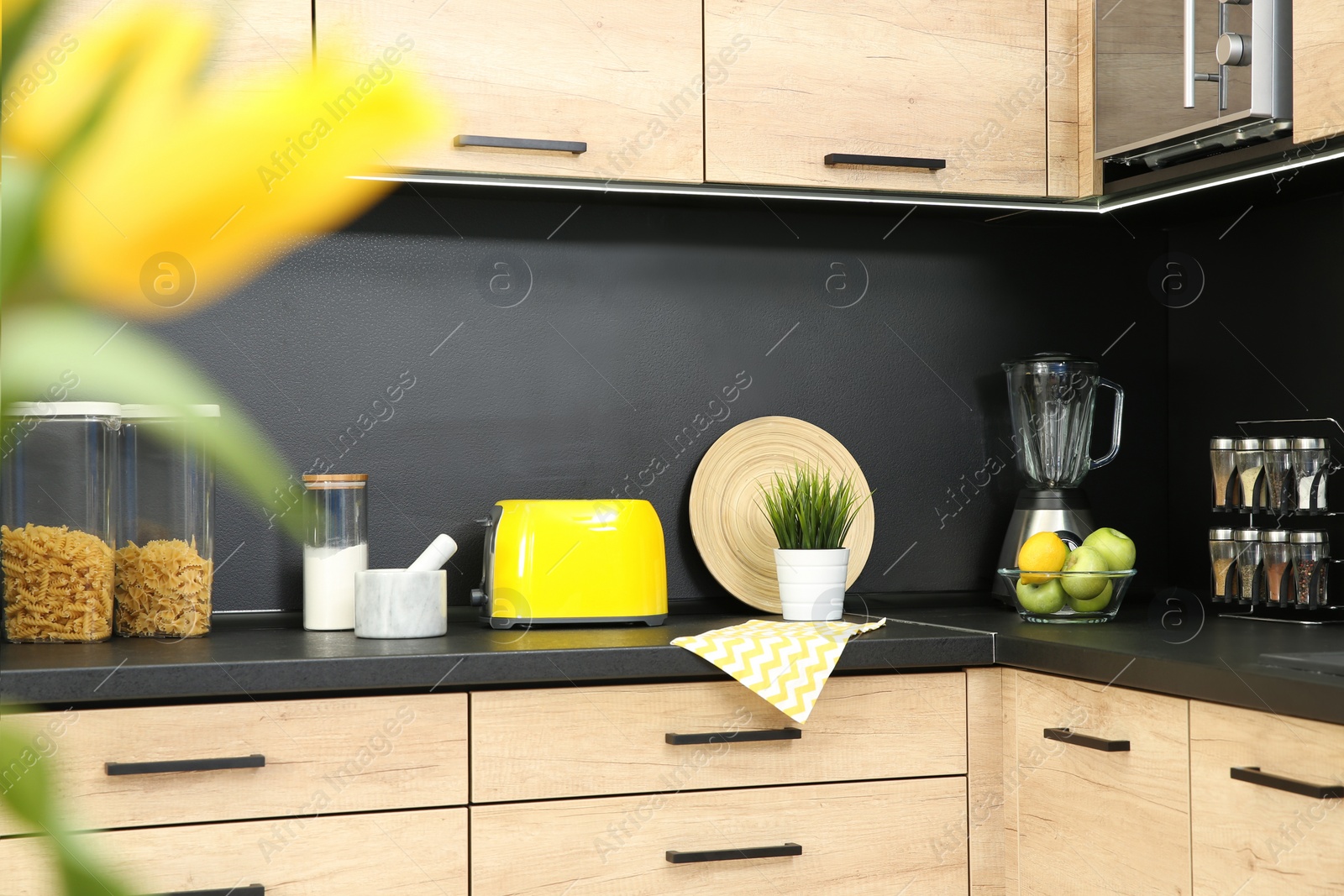 Photo of Kitchen interior with new furniture, appliances and houseware