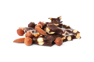 Photo of Delicious black chocolate with nuts on white background