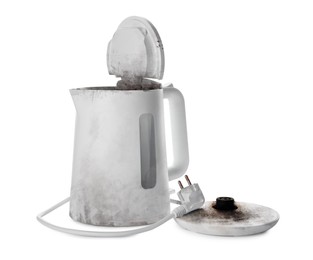 Burnt electric kettle with base and plug on white background