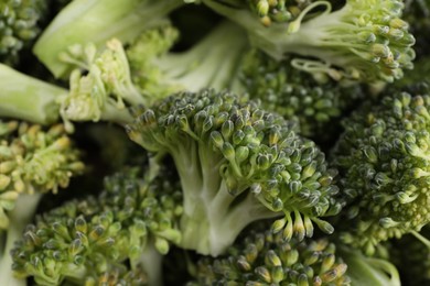 Photo of Fresh raw broccoli as background, closeup view