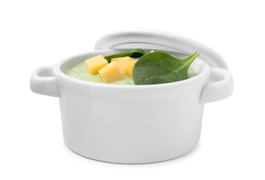 Delicious spinach cream soup with cheese in bowl isolated on white