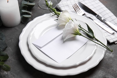 Photo of Elegant festive table setting on dark grey background