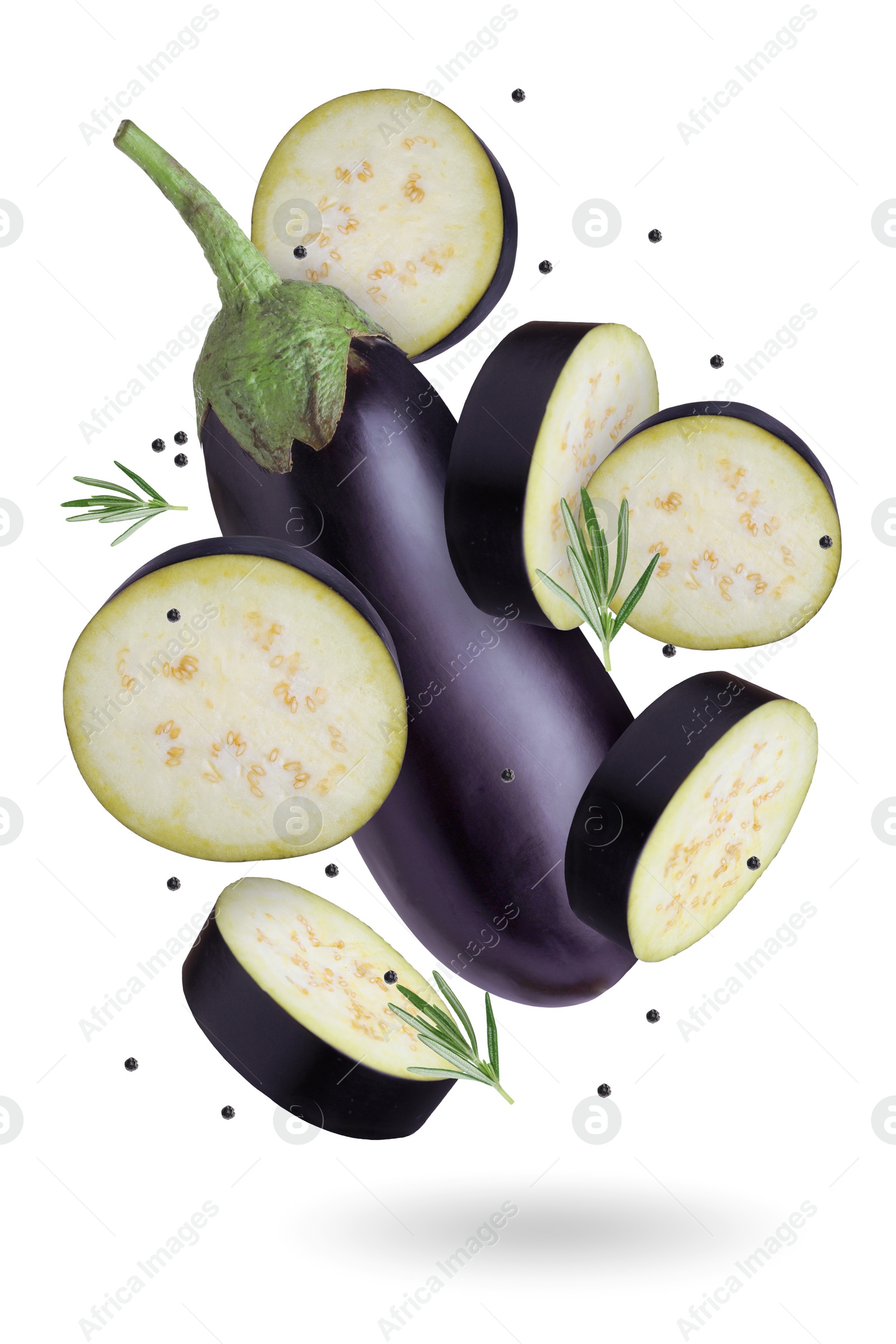 Image of Eggplants, rosemary and peppercorns falling on white background