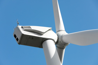 Wind turbine against beautiful sky, closeup. Alternative energy source